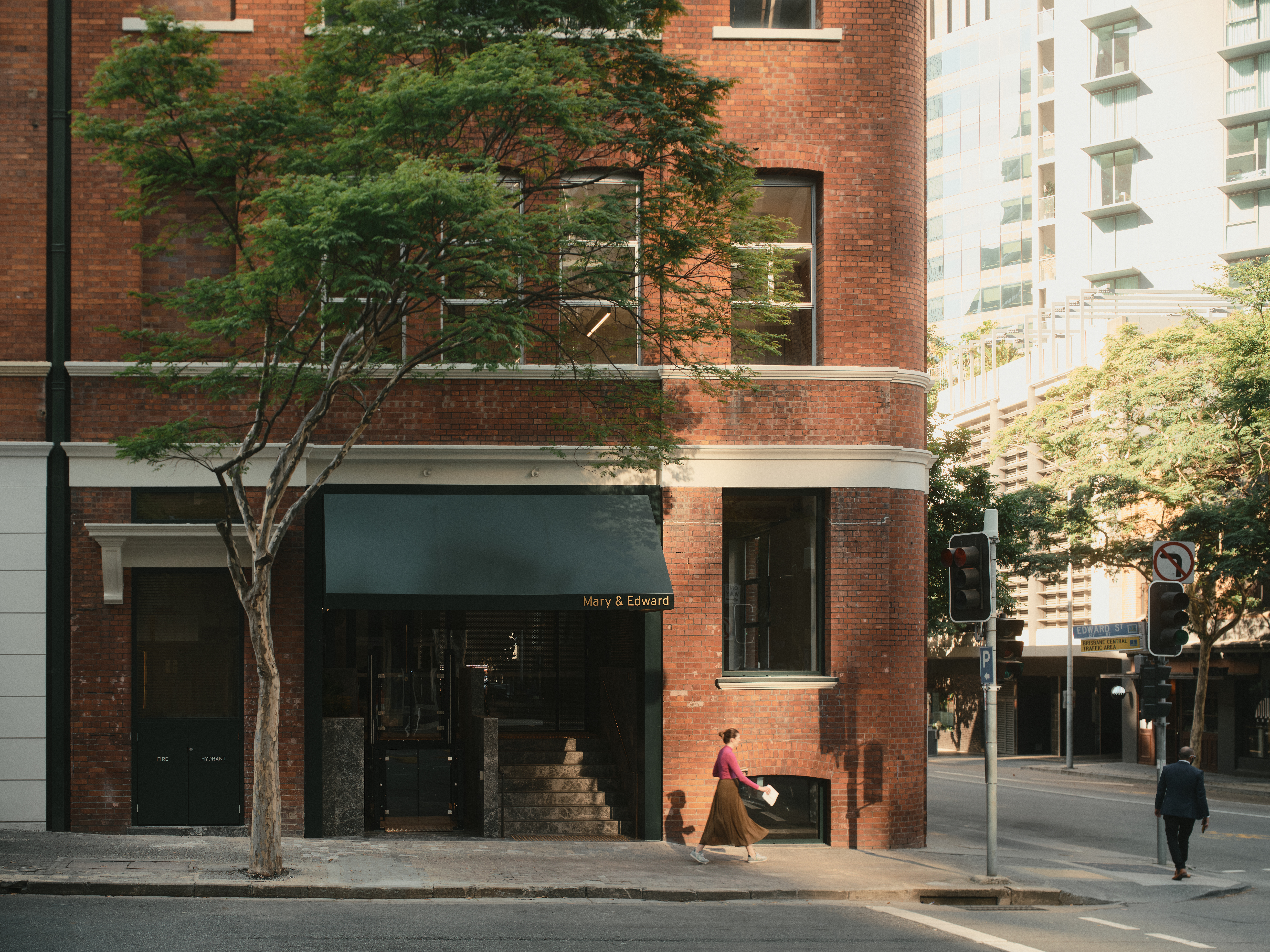 Architectural detail of the 93 Edward Street building facade, highlighting its brickwork and window arches.